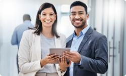 man and woman with ipad