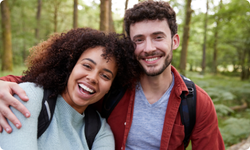 smiling young couple outside