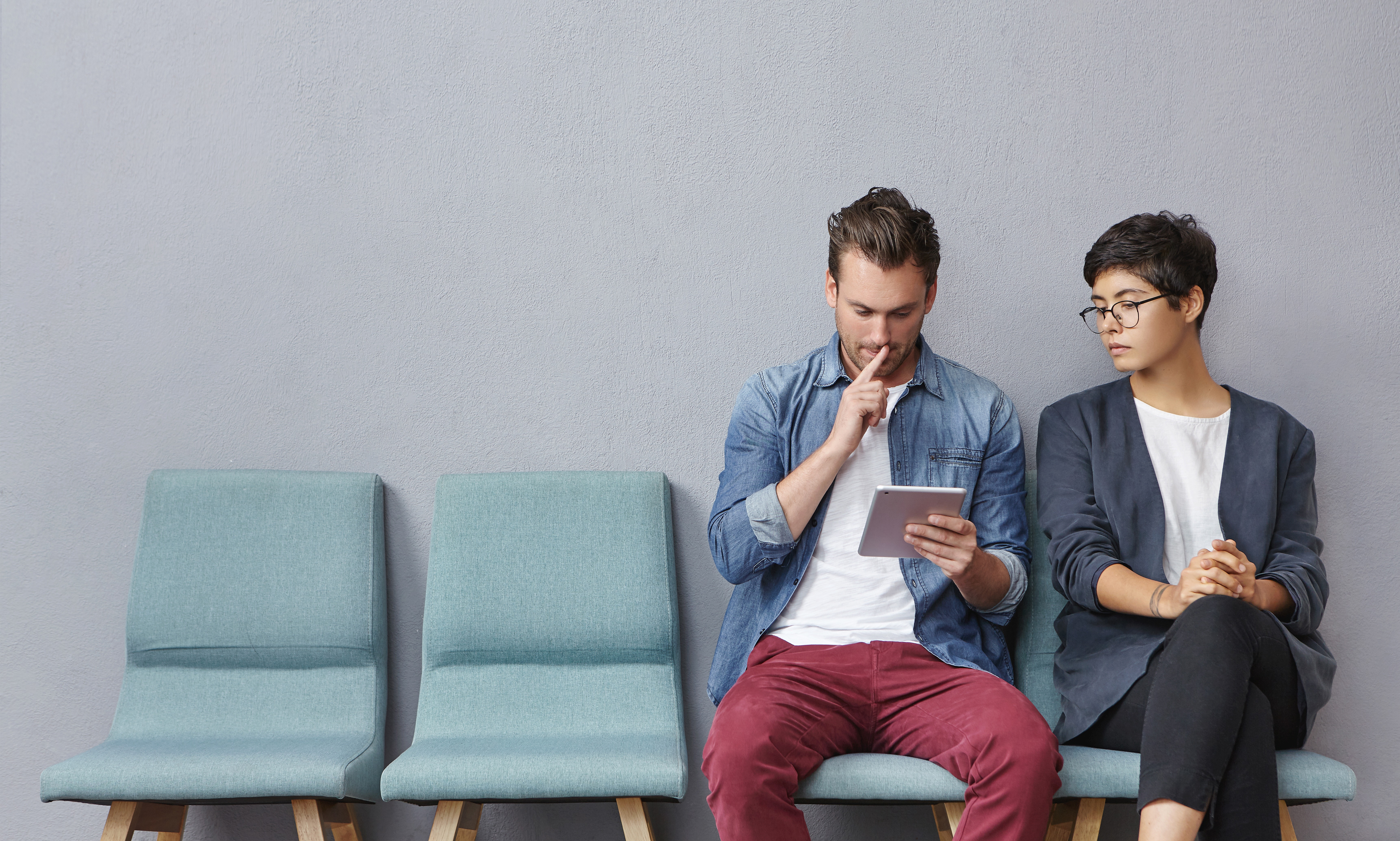 colleagues looking at mobile device